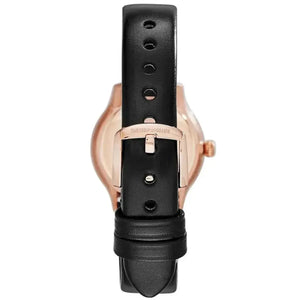 Close-up of black leather watch strap with gold buckle and visible brand engraving